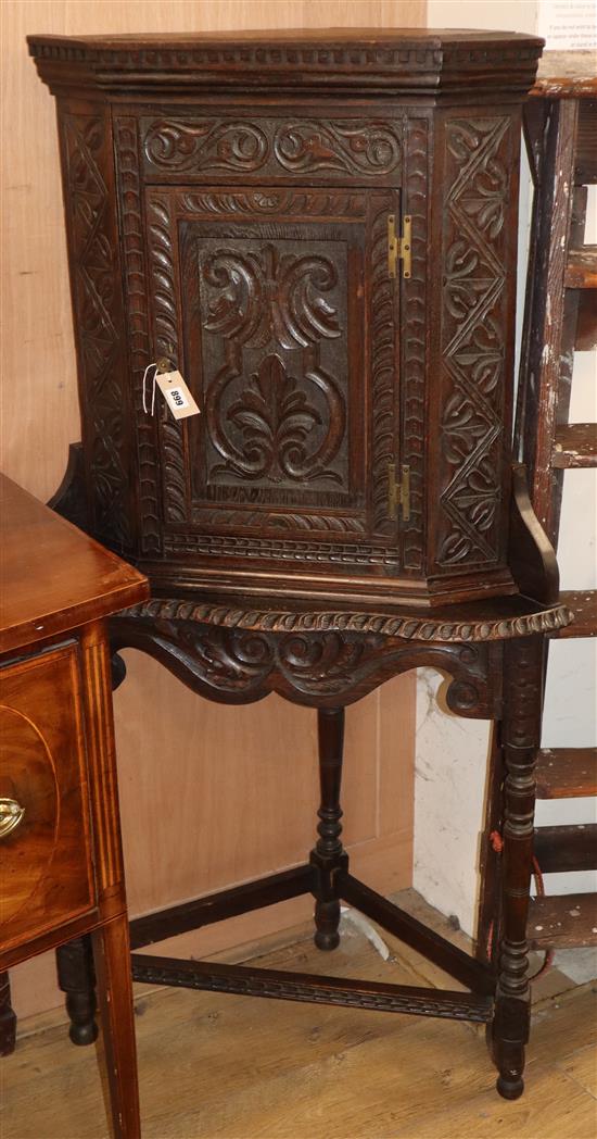 A Flemish carved oak corner table and cabinet Cabinet H.70cm